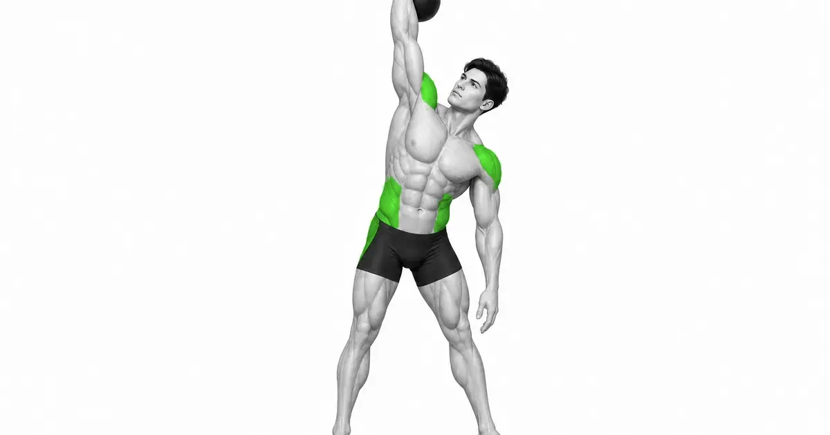 Kettlebell windmill with one arm holding the kettlebell above the head and the other hand lowered to the leg.